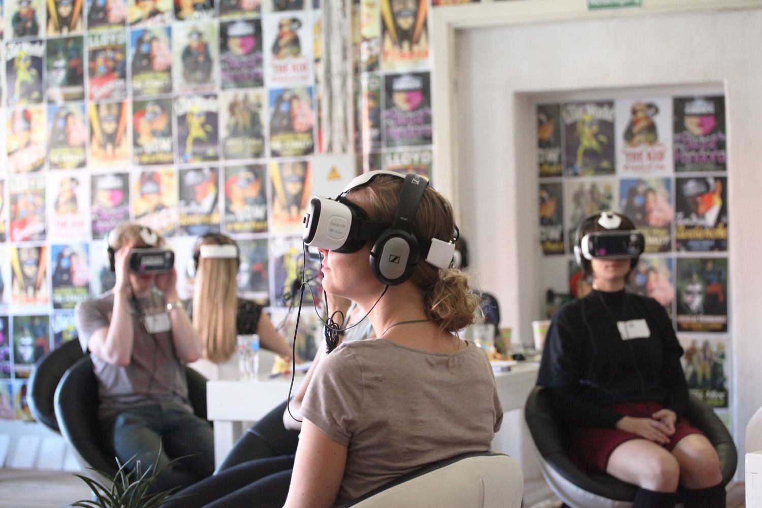 three people wearing virtual reality glasses