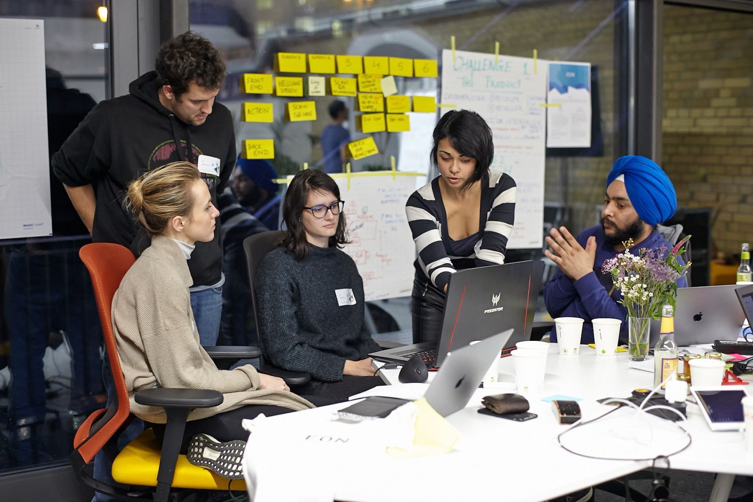 Team discusing a problem on N3XTCODER hackathon